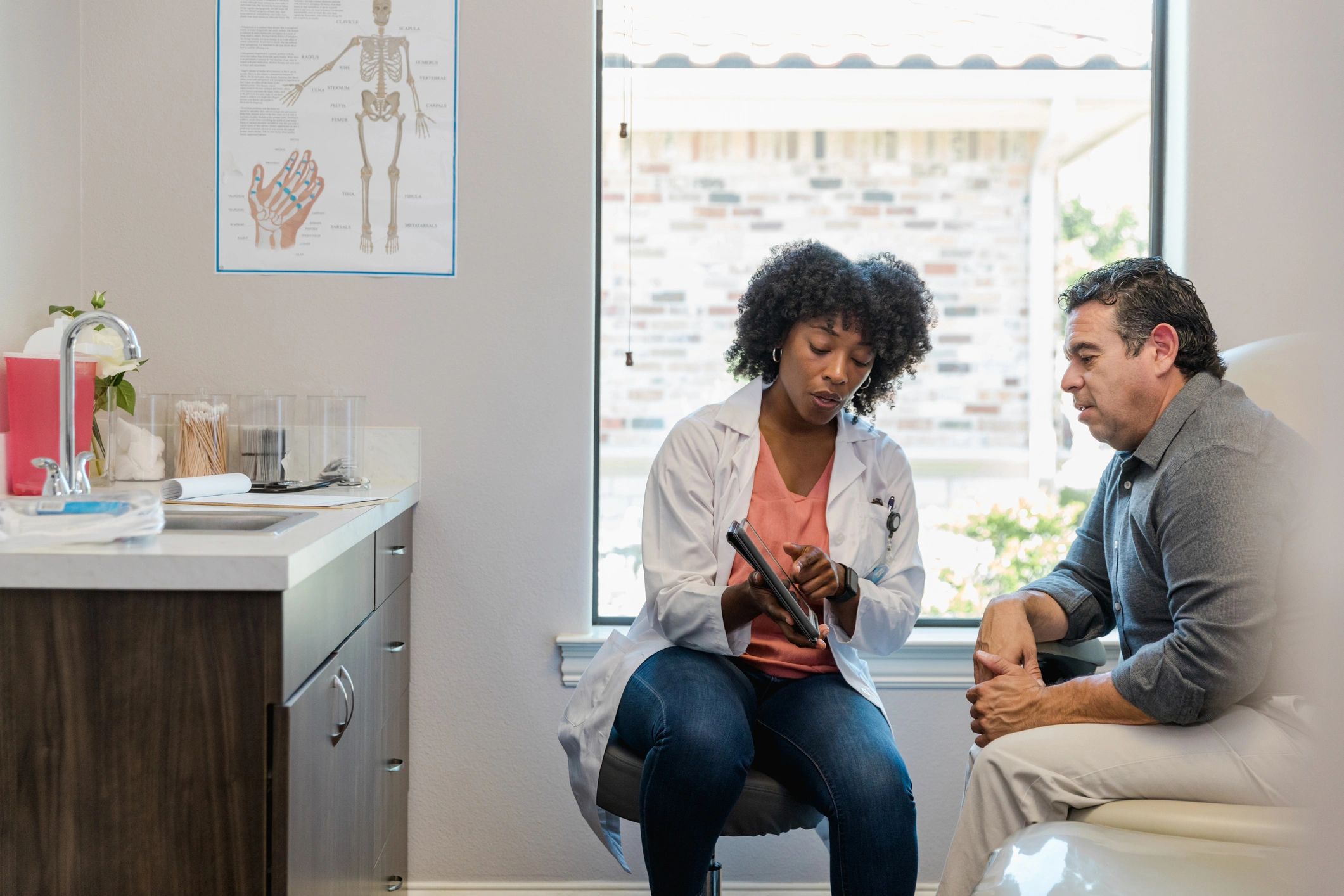 Doctor reviewing information with patient during a consultation