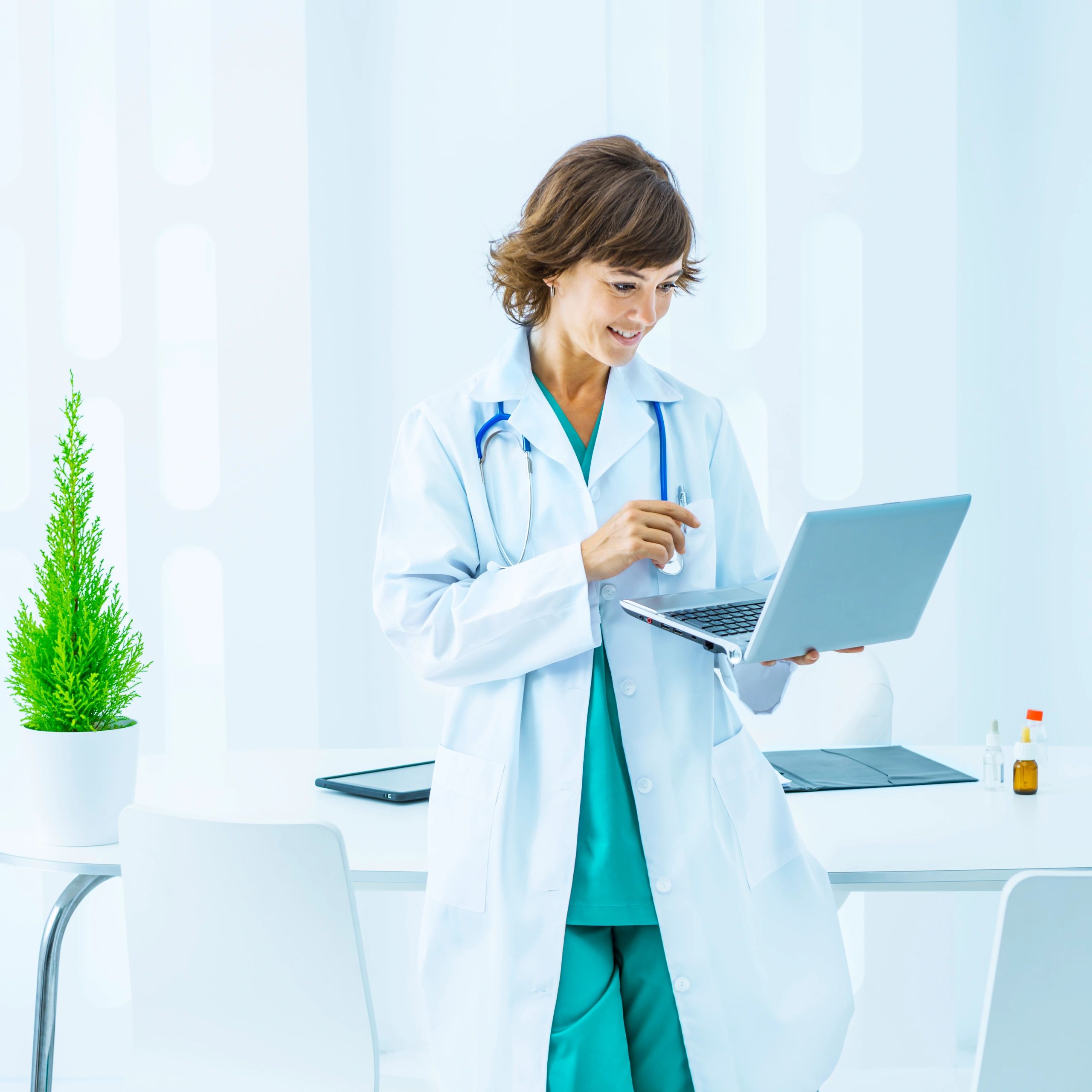 Clinician working on a laptop for a telehealth visit