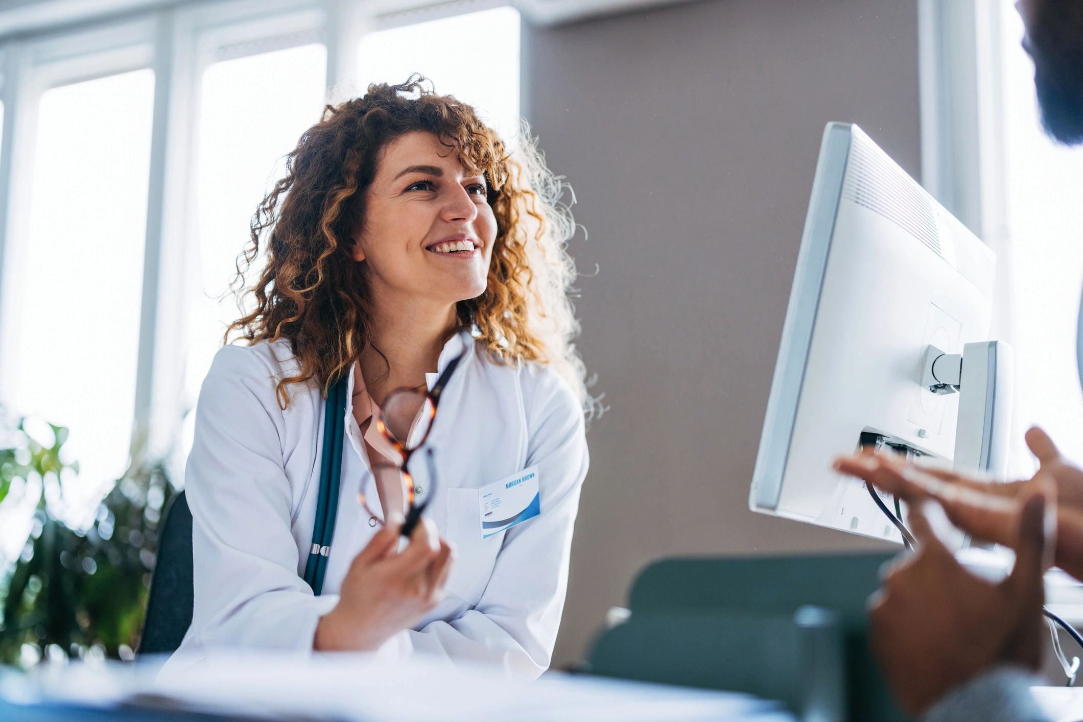 Doctor smiling during a patient consultation